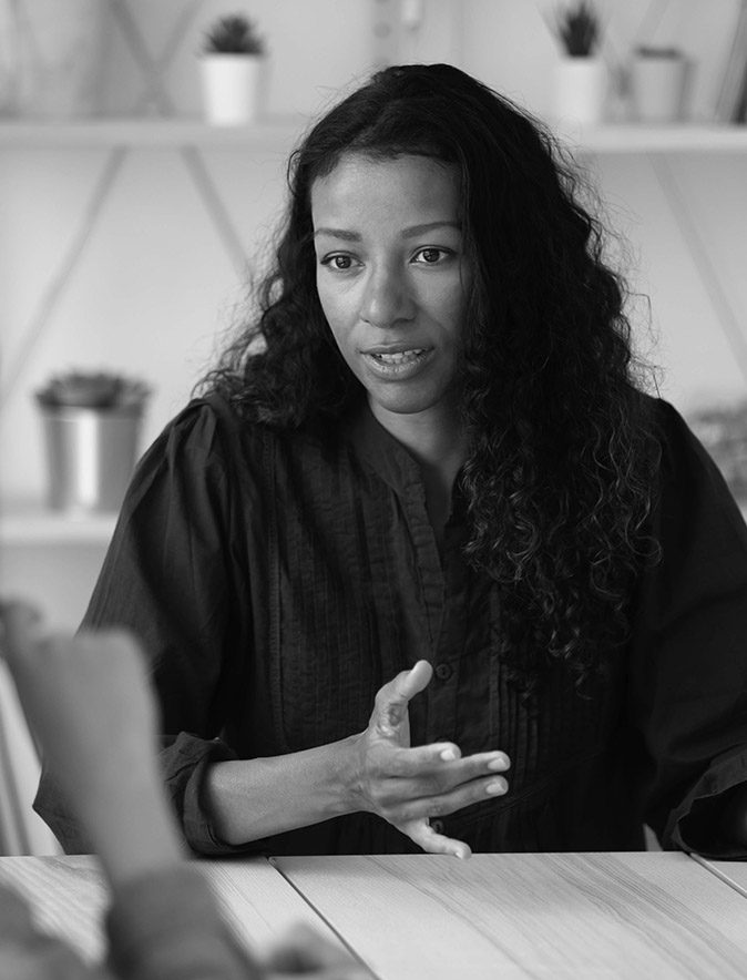 Close up confident african american businesswoman explaining new responsibilities.